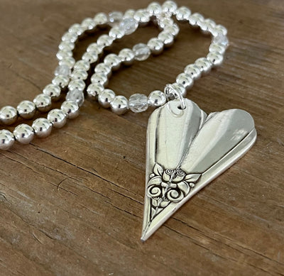 Vintage silverware heart pendant necklace detail - hand-forged from 1950s SL & GH Rogers Floral pattern - Laughing Frog Studio