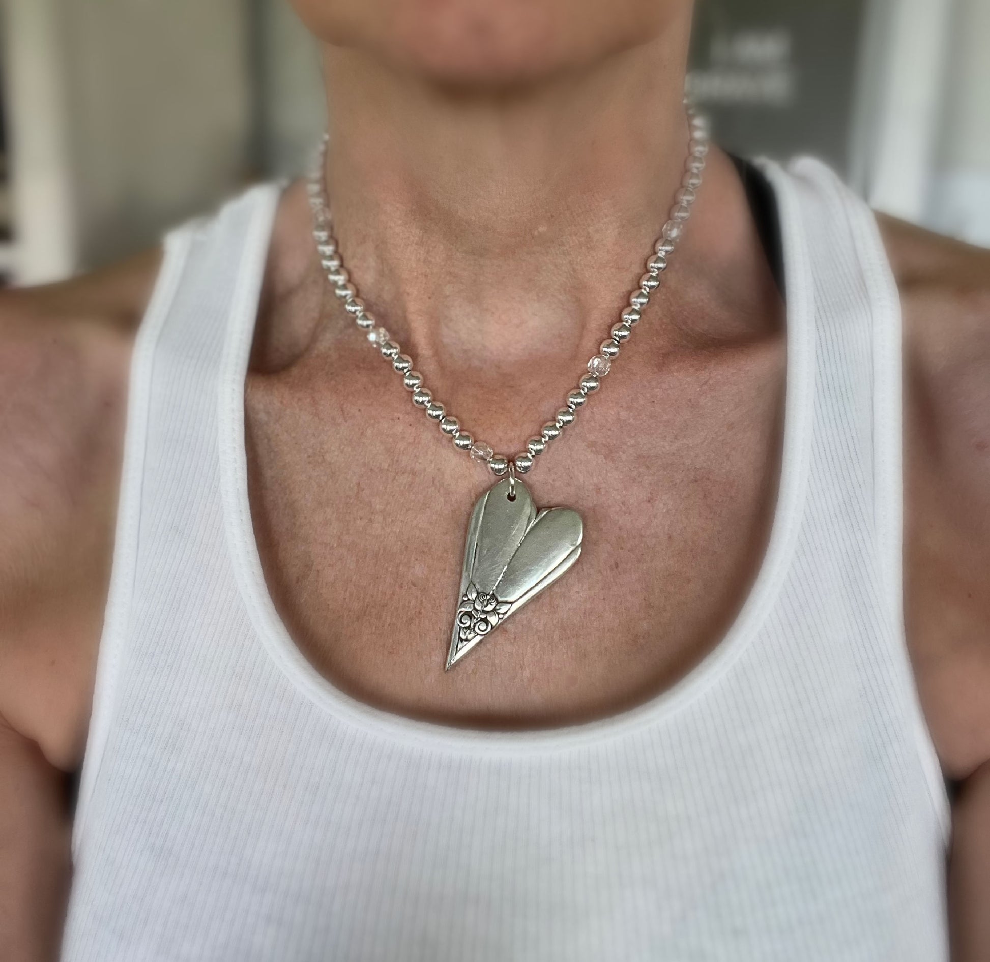 One-of-a-kind upcycled silverware heart choker necklace on model - handcrafted statement jewelry - Laughing Frog Studio