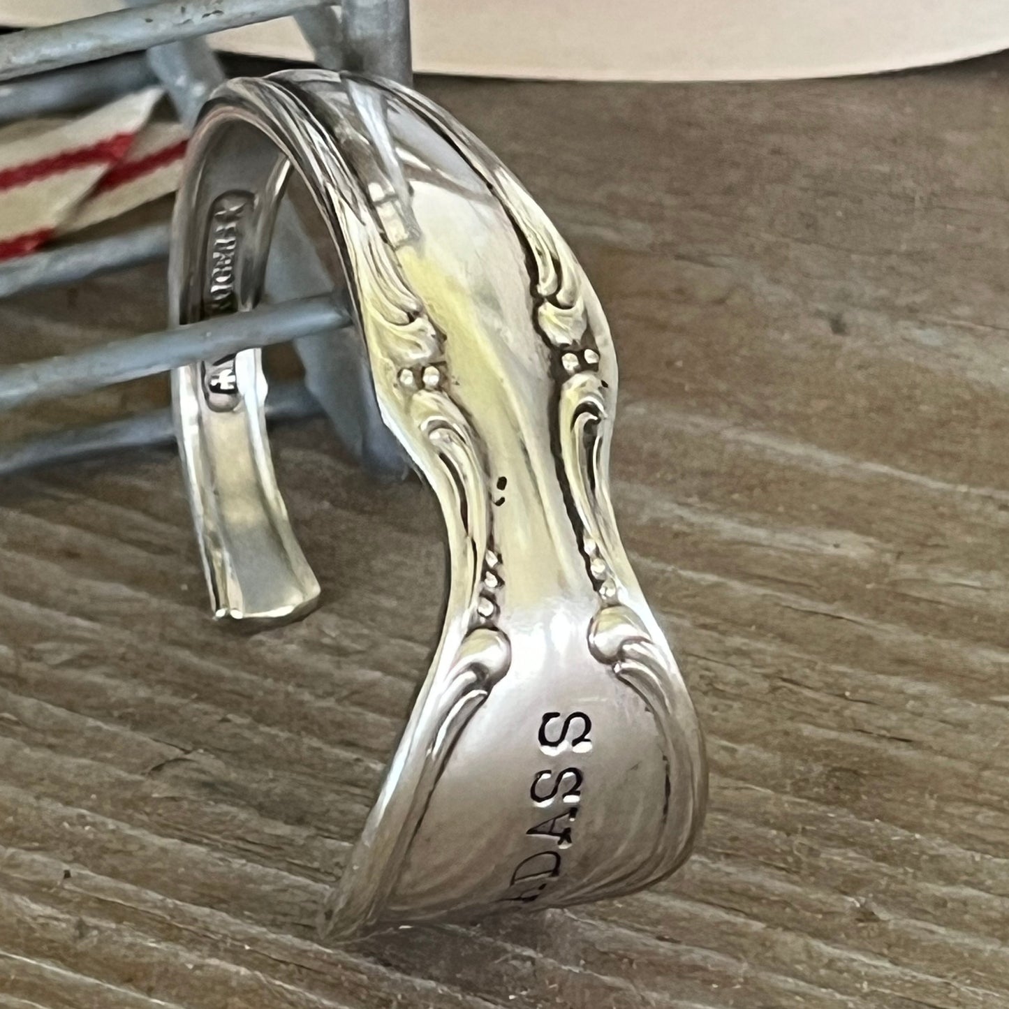 Detailed design view of PRECIOUS MIRROR hand-stamped BADASS spoon cuff bracelet - handcrafted from upcycled vintage silverware - Laughing Frog Studio