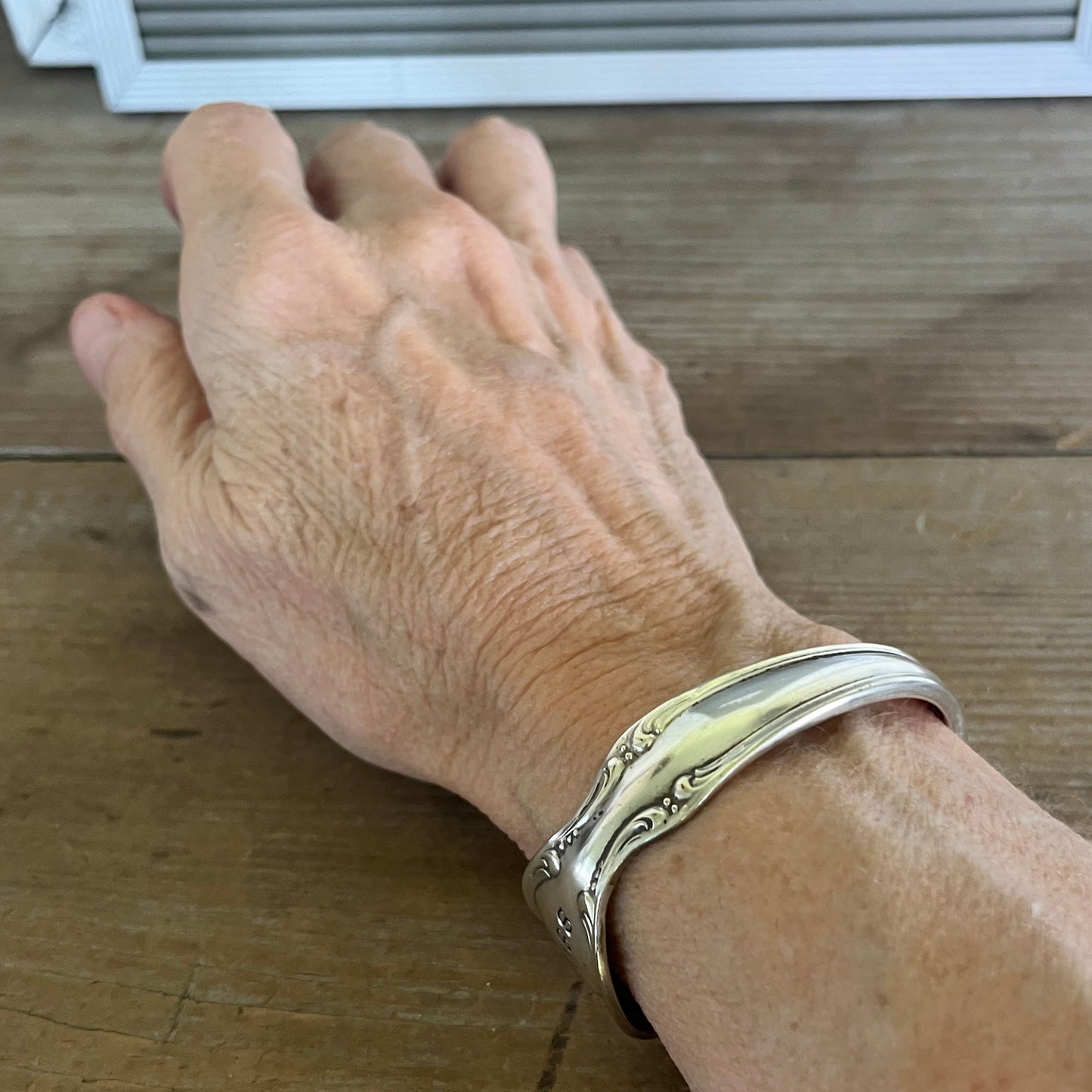 PRECIOUS MIRROR hand-stamped BADASS spoon cuff bracelet shown on wrist - handcrafted from upcycled vintage silverware - Laughing Frog Studio