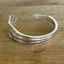 back view of COMMUNITY AVALON hand-stamped BADASS spoon cuff bracelet - handcrafted from upcycled vintage silverware - Laughing Frog Studio