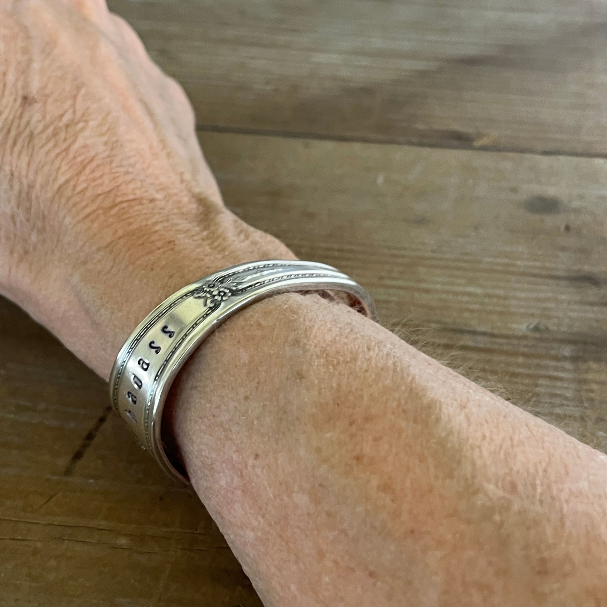 R.C. Co BOUQUET / VENDOME hand-stamped BADASS spoon cuff bracelet shown on wrist - handcrafted from upcycled vintage silverware - Laughing Frog Studio