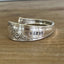 Detail view of stamping on QUEEN BESS hand-stamped BADASS spoon cuff bracelet - handcrafted from upcycled vintage silverware - Laughing Frog Studio