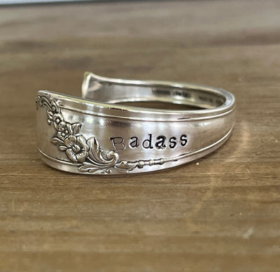 Detail view of stamping on QUEEN BESS hand-stamped BADASS spoon cuff bracelet - handcrafted from upcycled vintage silverware - Laughing Frog Studio