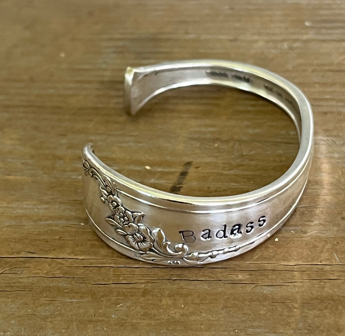 Top view of QUEEN BESS hand-stamped BADASS spoon cuff bracelet - handcrafted from upcycled vintage silverware - Laughing Frog Studio
