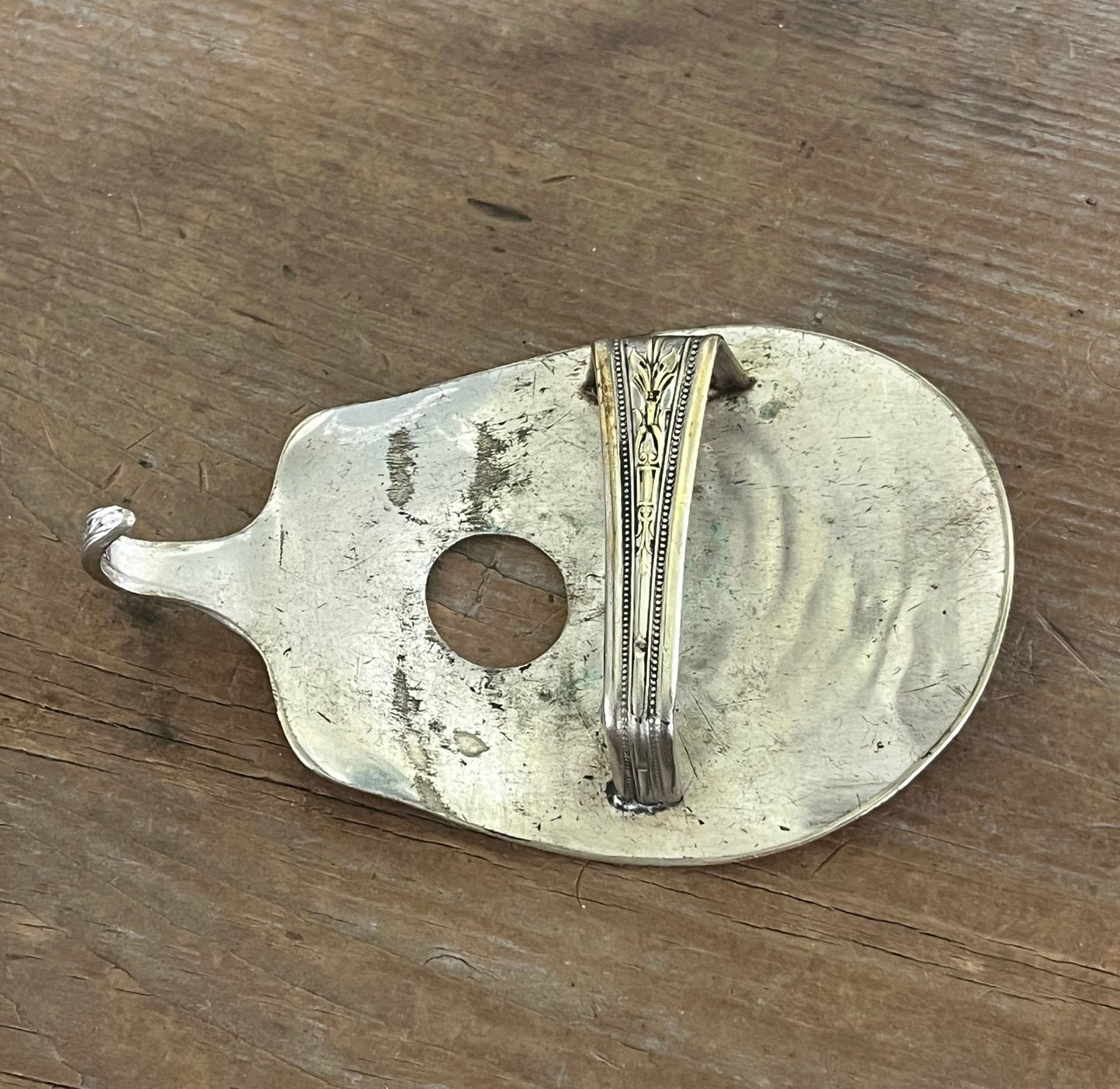 Hand-stamped stars pattern guitar spoon belt buckle, back view showing catch and prong - handcrafted from upcycled vintage silverware - Laughing Frog Studio