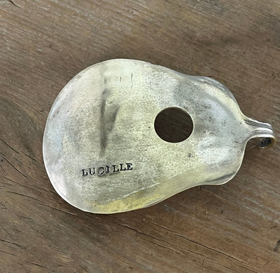 Lucille guitar spoon belt buckle, close up of patina - handcrafted from upcycled vintage silverware - Laughing Frog Studio