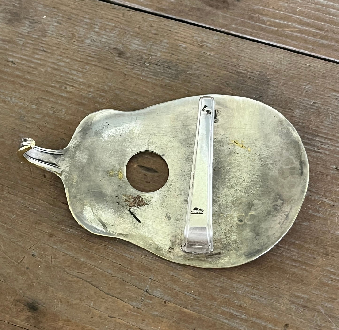 Lucille guitar spoon belt buckle, flat lay close-up of back side - handcrafted from upcycled vintage silverware - Laughing Frog Studio