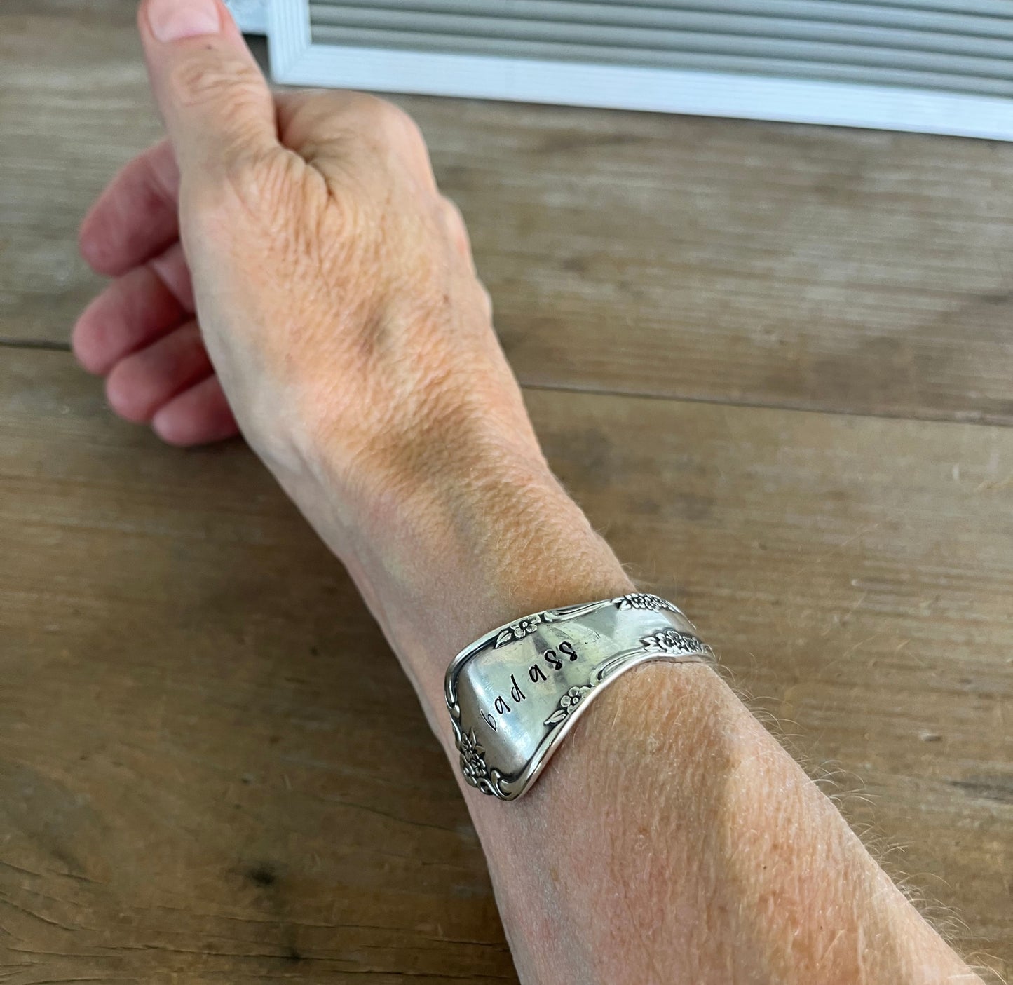 Affection pattern silverplate cuff bracelet worn on wrist - upcycled vintage silverware jewelry - Laughing Frog Studio
