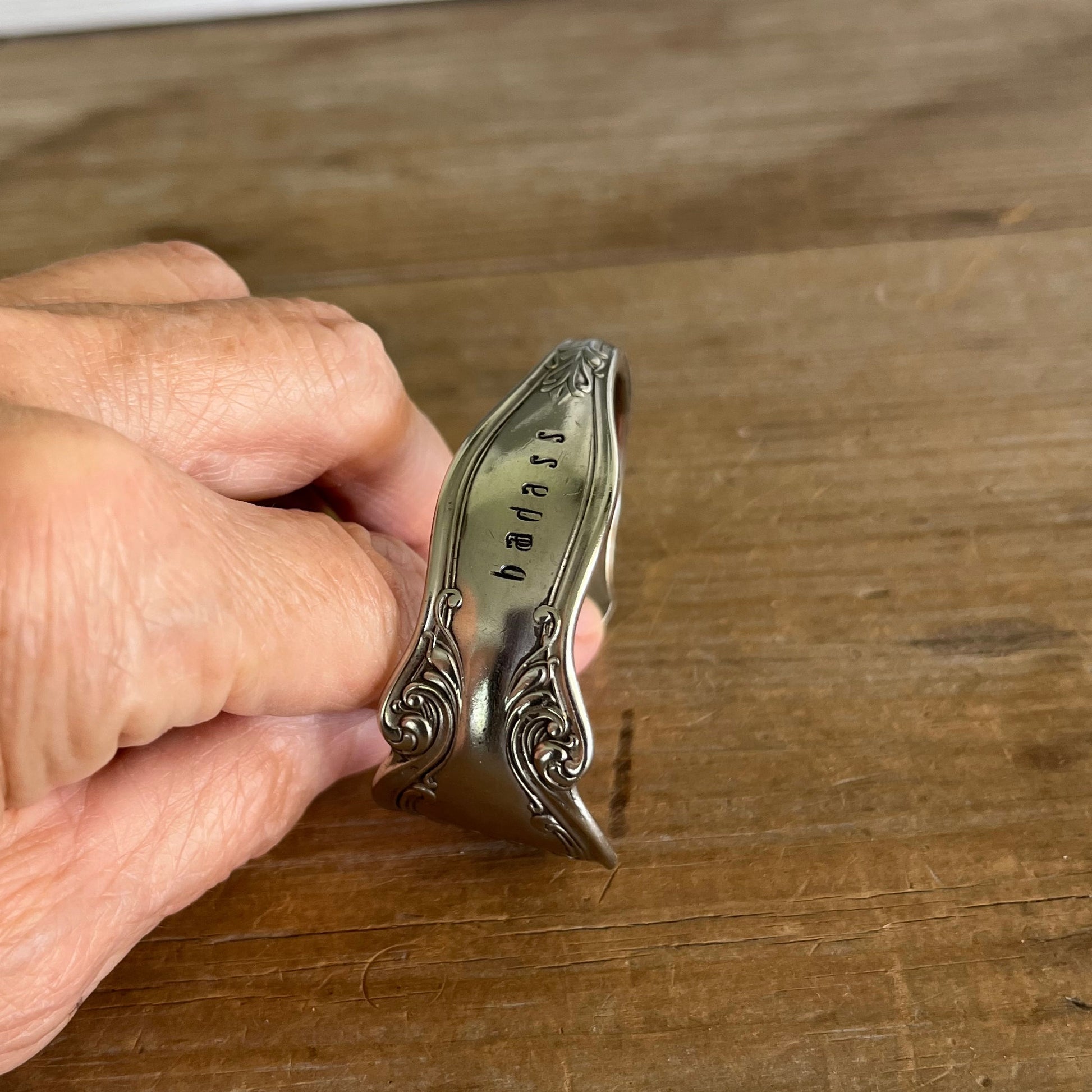 Hand-stamped BADASS lettering detail on upcycled Queen Ann silverplate spoon cuff bracelet - Laughing Frog Studio