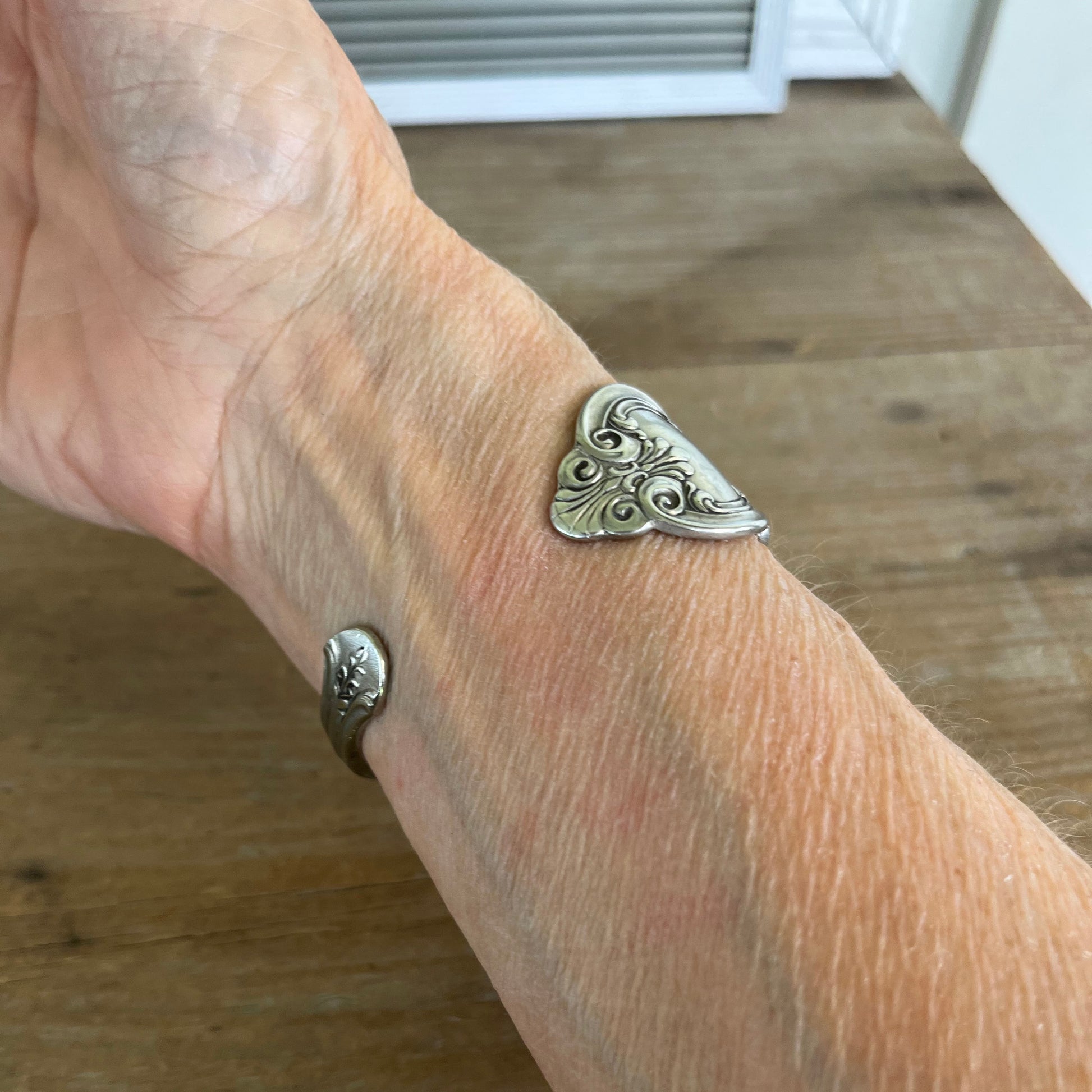 Queen Ann pattern silverplate cuff bracelet underside view worn on wrist - upcycled vintage silverware jewelry - Laughing Frog Studio