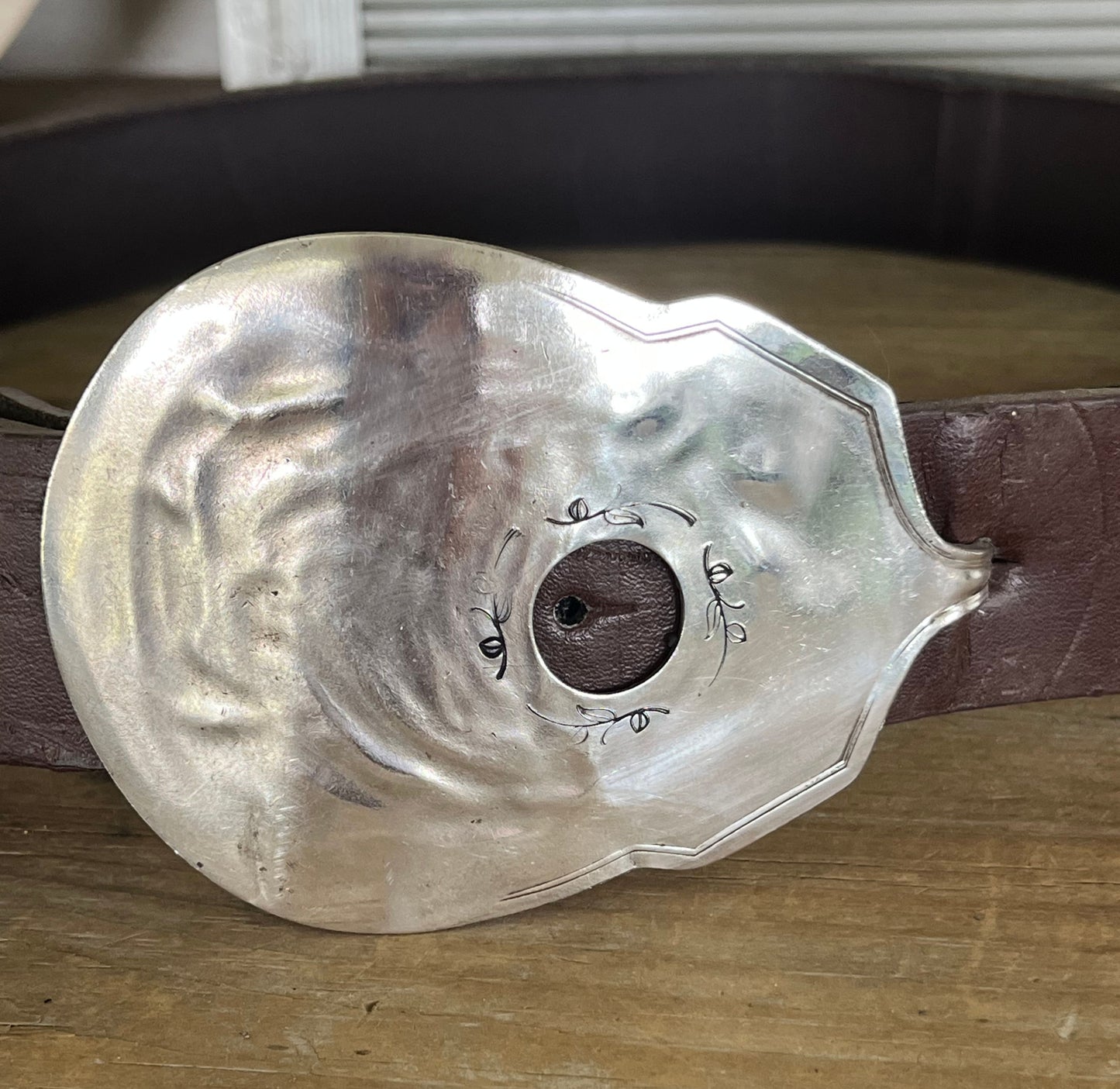 Guitar-shaped belt buckle handcrafted from upcycled vintage silverplate casserole spoon - one-of-a-kind wearable art for music lovers - Laughing Frog Studio