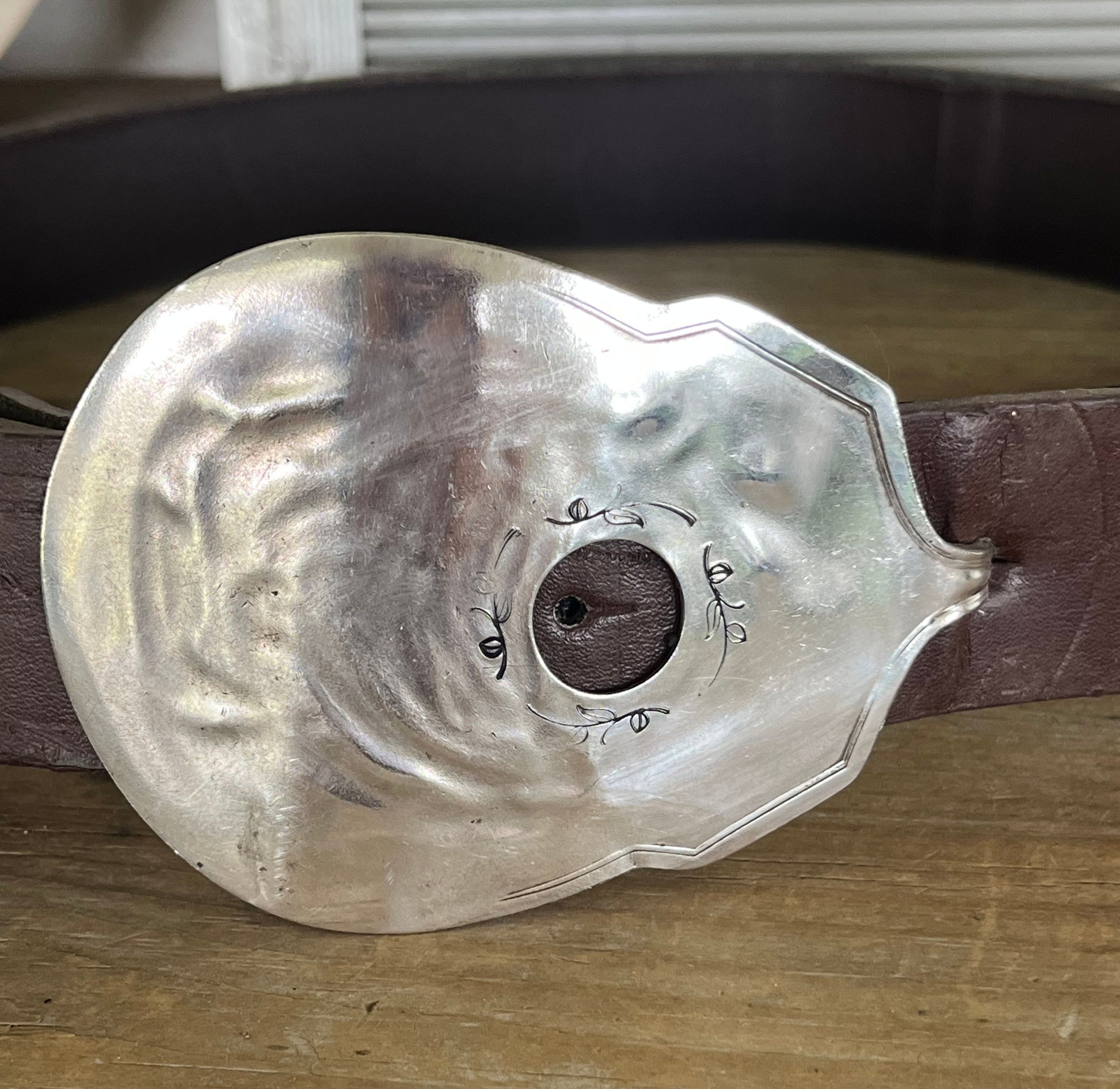 Guitar-shaped belt buckle handcrafted from upcycled vintage silverplate casserole spoon - one-of-a-kind wearable art for music lovers - Laughing Frog Studio