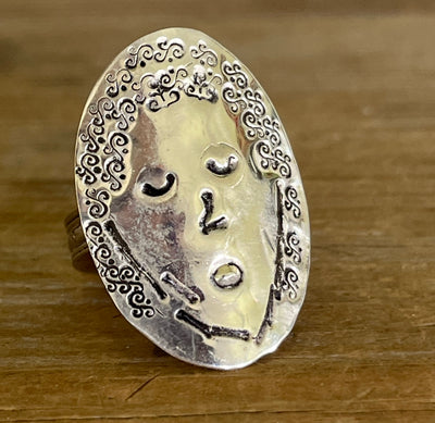 Close-up of hand-stamped symbols creating the face of FLORA spoon ring bowl - upcycled vintage silverware ring - Laughing Frog Studio