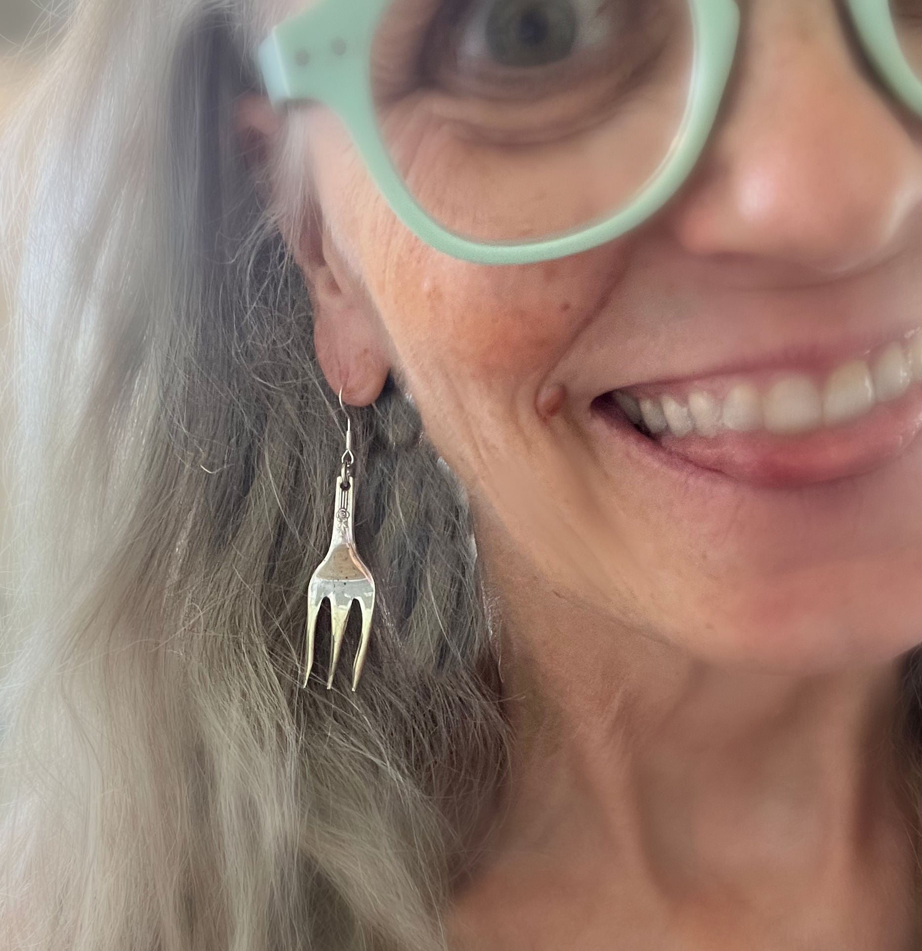 Spoon earring from mismatched spoon and fork earrings worn on model - handcrafted upcycled silverware jewelry for foodies - Laughing Frog Studio