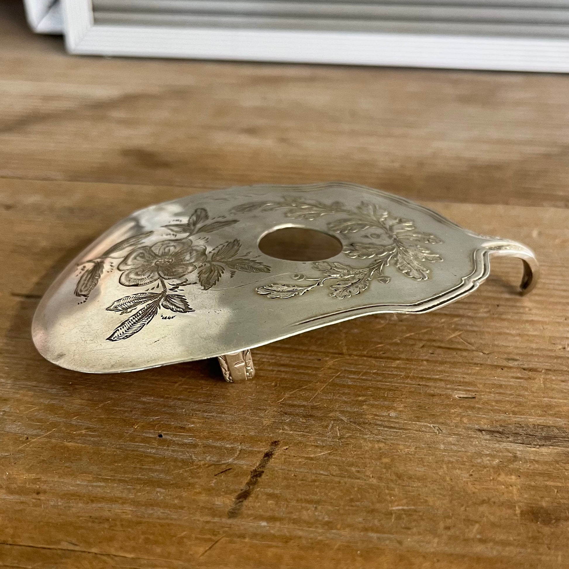 Side view of guitar spoon belt buckle showing sculptural shape - upcycled vintage silverware accessory - Laughing Frog Studio
