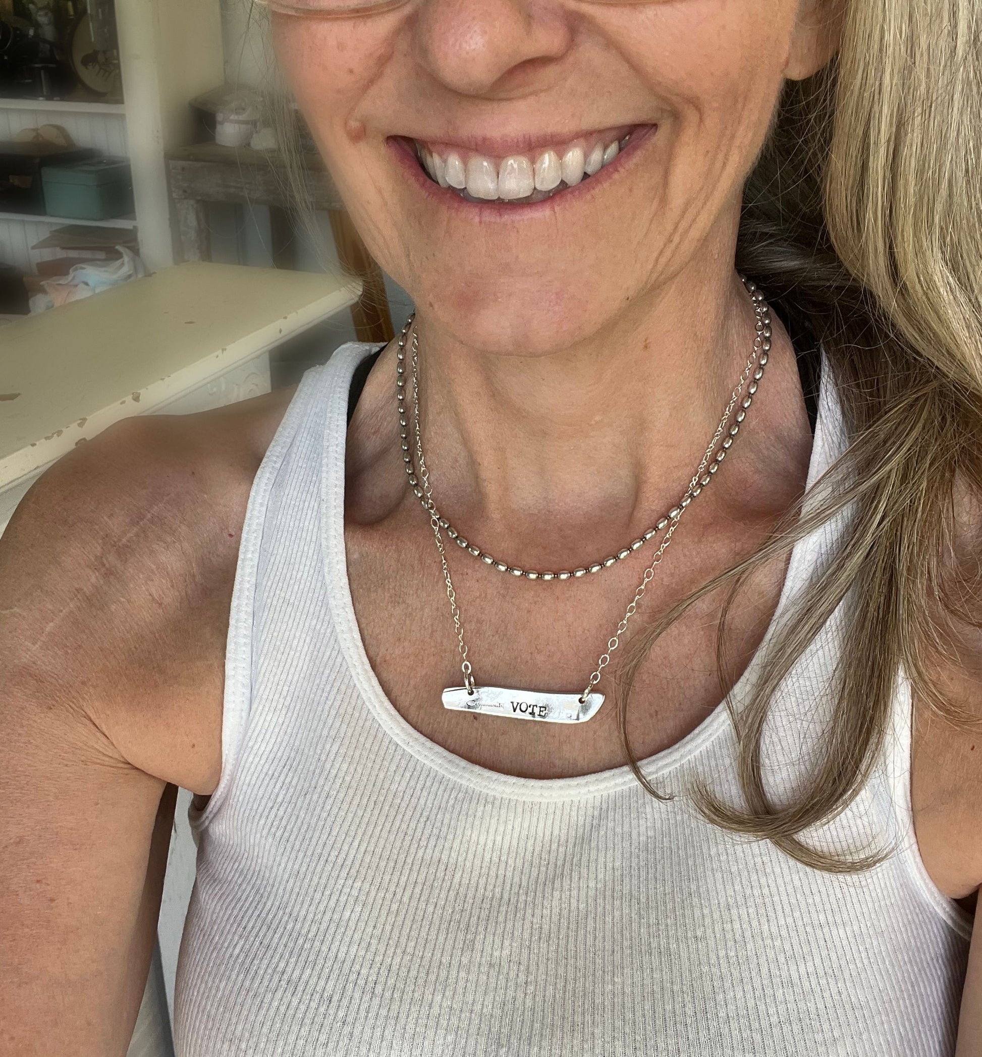 VOTE COMMUNITY bar pendant necklace worn on model - hand-stamped upcycled vintage silverware jewelry - Laughing Frog Studio

