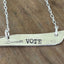 Close-up of VOTE hand-stamping detail on upcycled vintage silverplate bar pendant necklace - Laughing Frog Studio