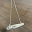 Close-up of VOTE hand-stamped bar pendant choker necklace - upcycled vintage 1847 Rogers Bros. Daffodil silverplate - Laughing Frog Studio