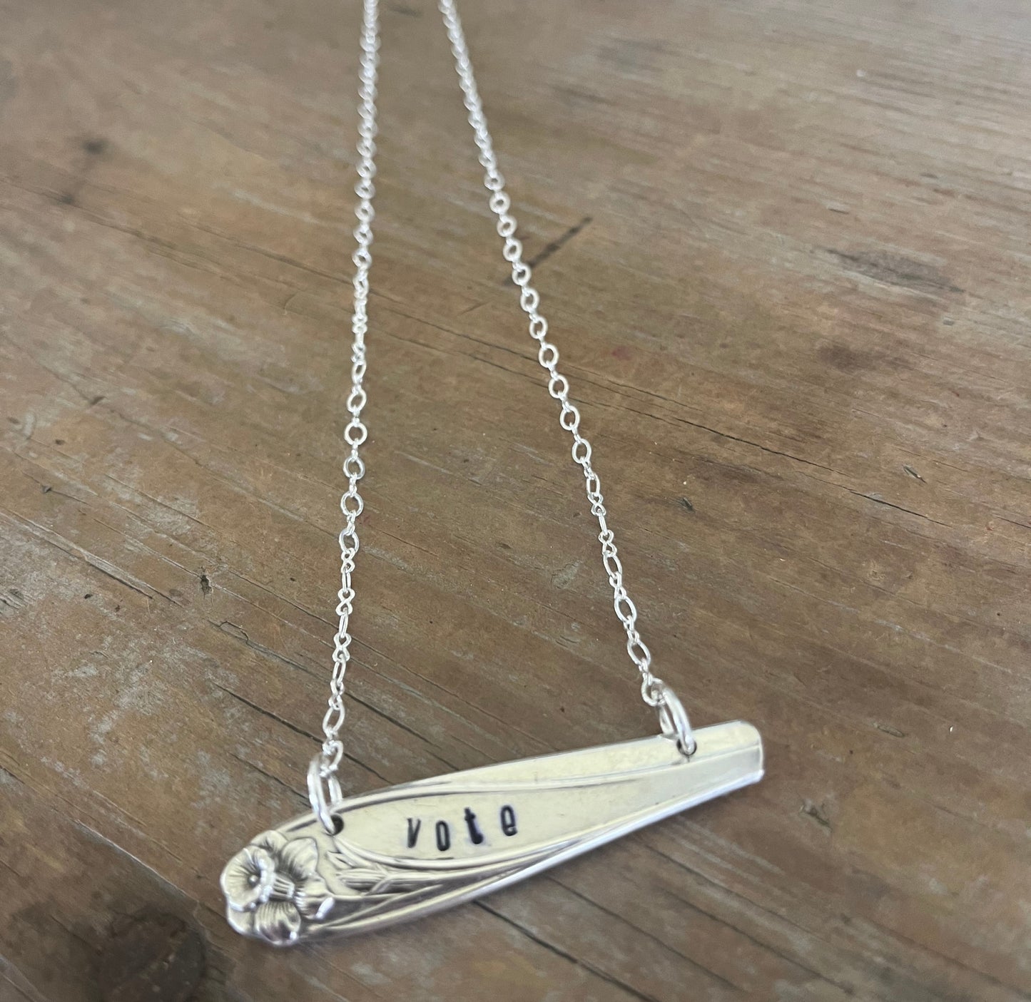 Close-up of VOTE hand-stamped bar pendant choker necklace - upcycled vintage 1847 Rogers Bros. Daffodil silverplate - Laughing Frog Studio