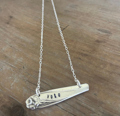 Close-up of VOTE hand-stamped bar pendant choker necklace - upcycled vintage 1847 Rogers Bros. Daffodil silverplate - Laughing Frog Studio
