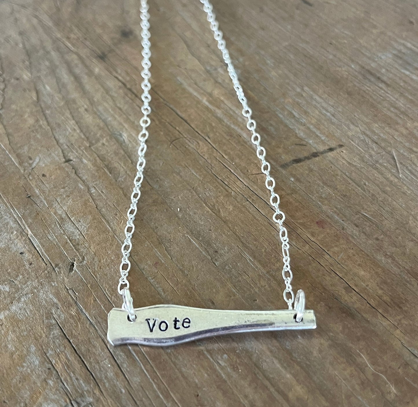 VOTE bar choker necklace full flat lay close up view - hand-stamped upcycled vintage Wallace silverplate - Laughing Frog Studio