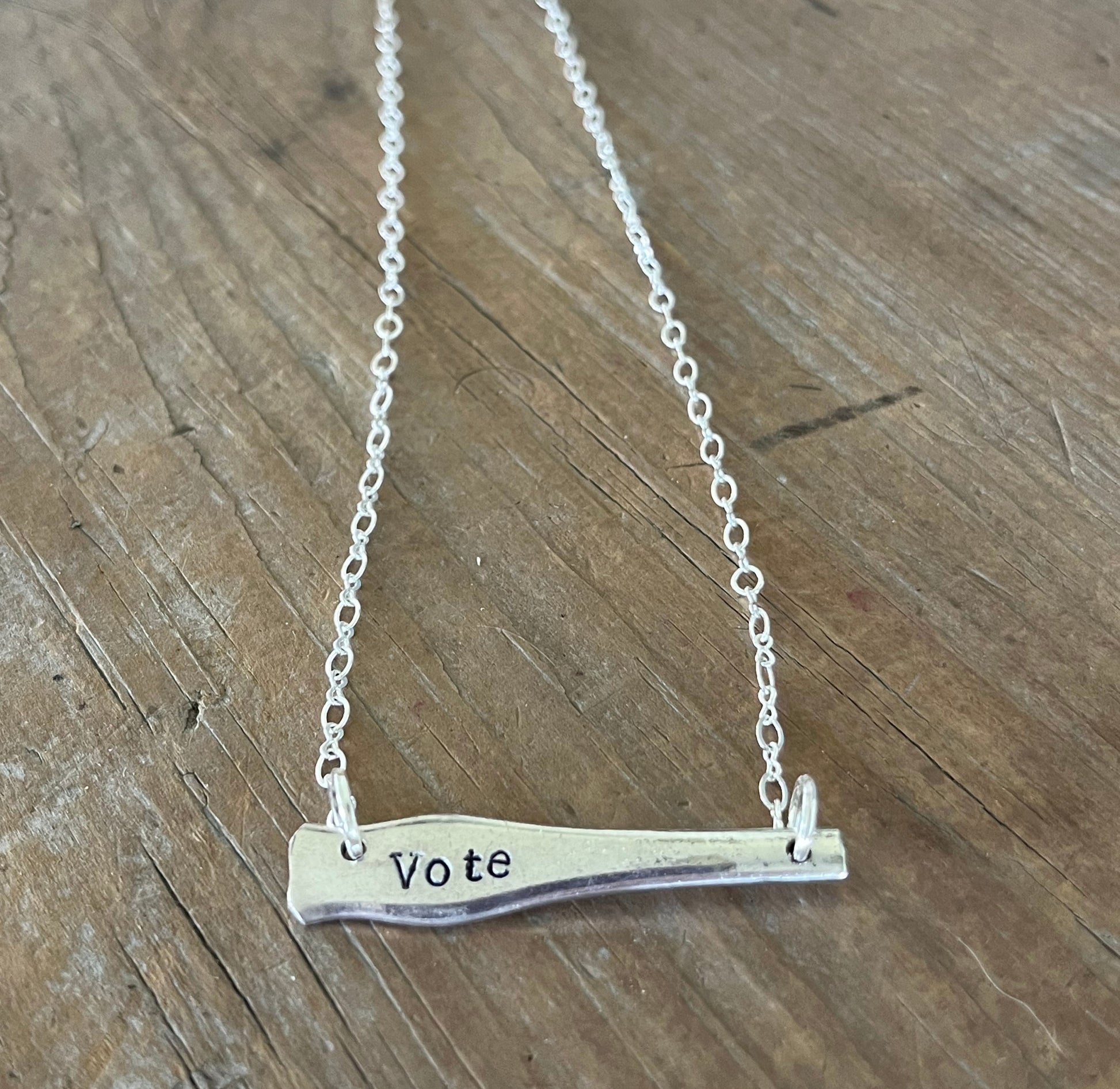 VOTE bar choker necklace full flat lay close up view - hand-stamped upcycled vintage Wallace silverplate - Laughing Frog Studio