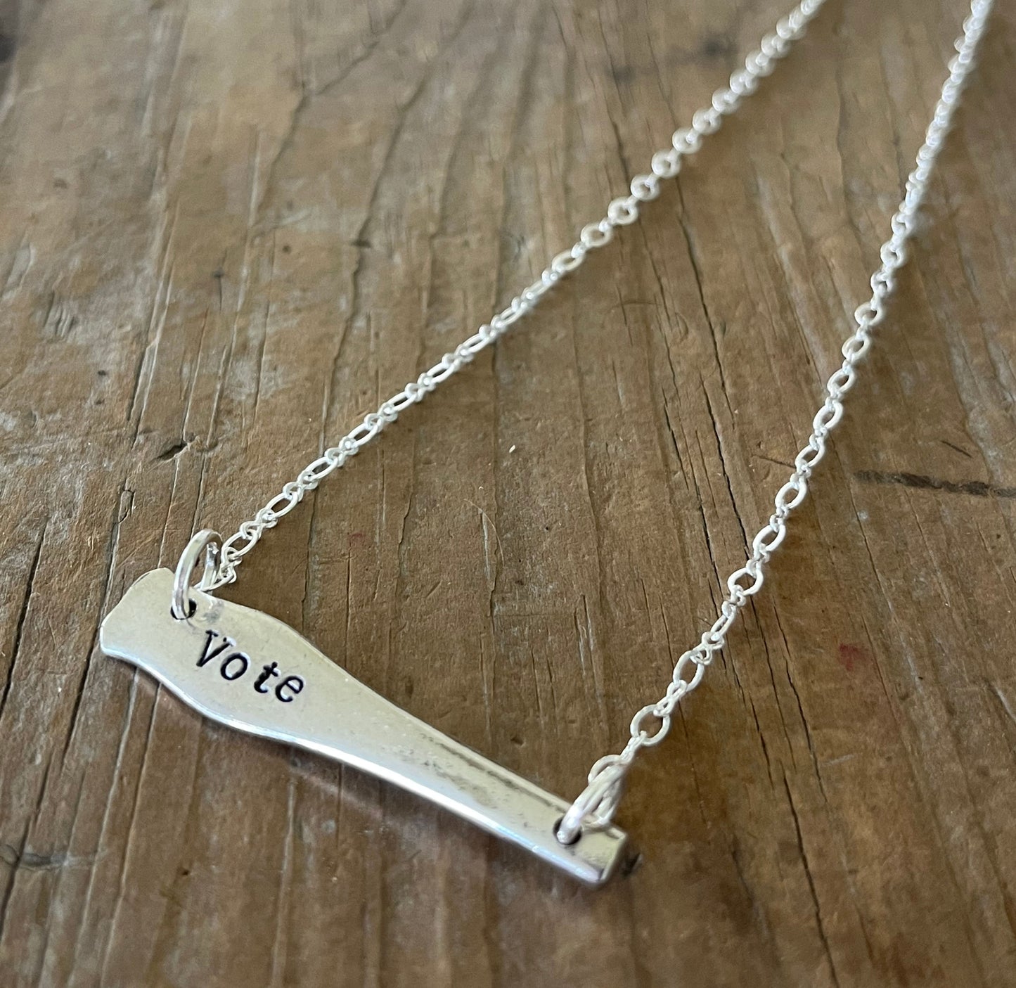 VOTE bar choker necklace full flat lay super close up view - hand-stamped upcycled vintage Wallace silverplate - Laughing Frog Studio