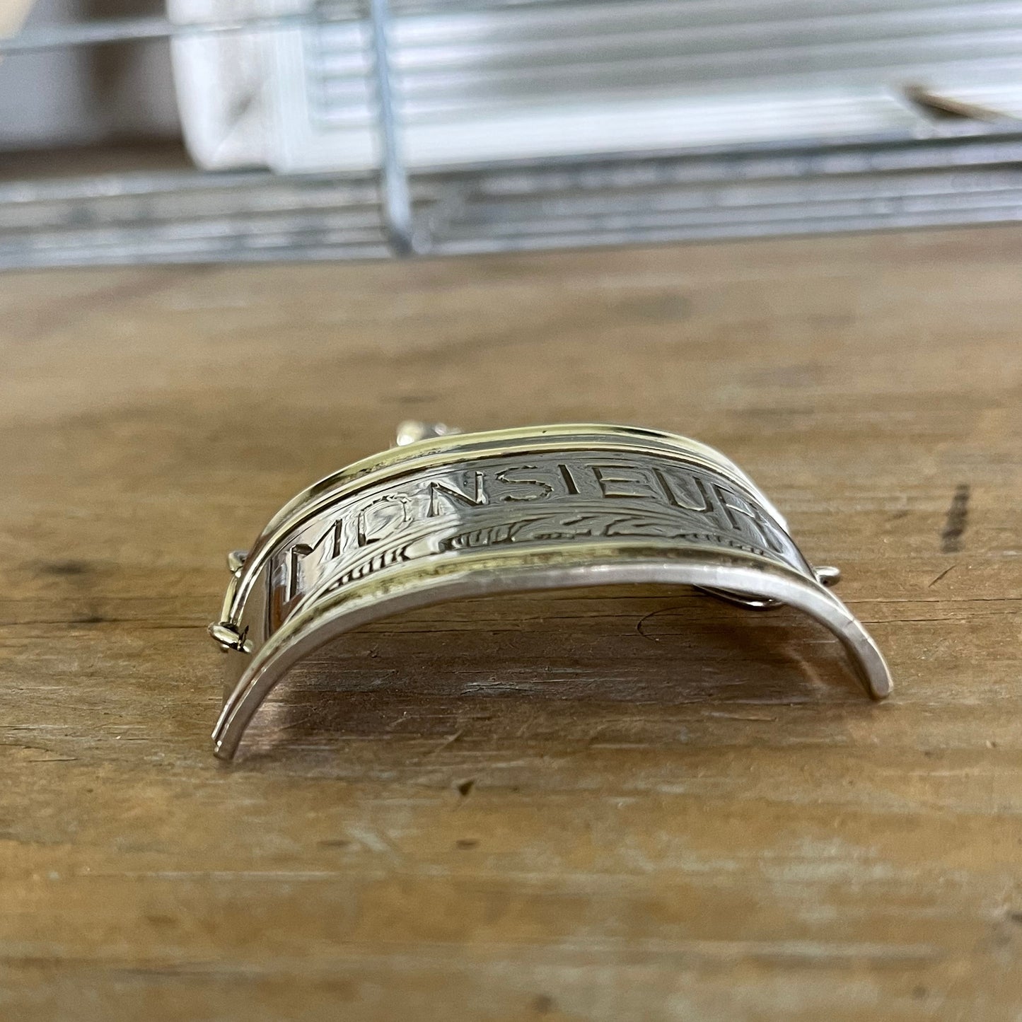 Side view of vintage silverplate napkin ring link bracelet with Monsieur engraving - handcrafted from upcycled vintage silverware - Laughing Frog Studio