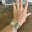 Vintage silverplate napkin ring link bracelet with Monsieur engraving shown on model - handcrafted from upcycled vintage silverware - Laughing Frog Studio