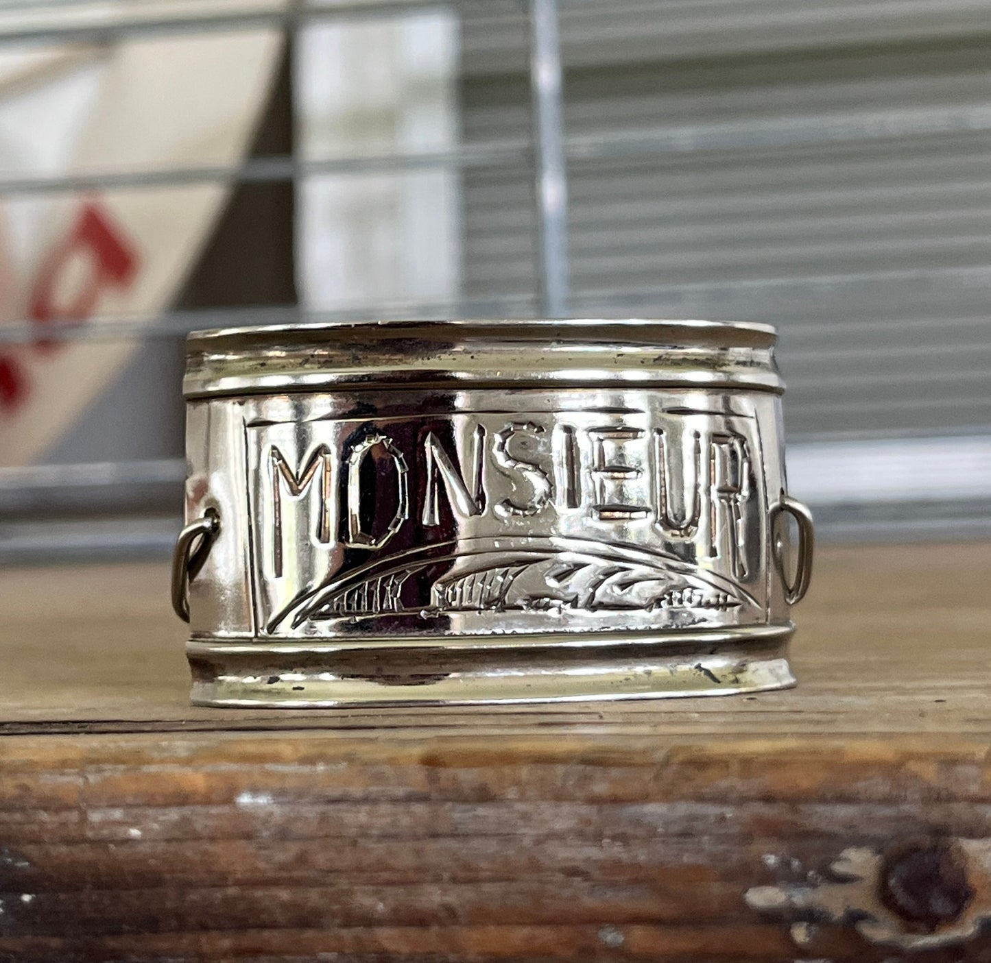 Close up view of vintage silverplate napkin ring link bracelet with Monsieur engraving - handcrafted from upcycled vintage silverware - Laughing Frog Studio