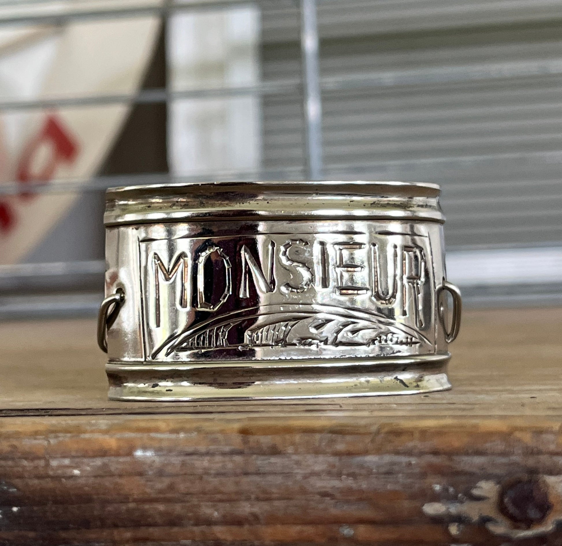 Close up view of vintage silverplate napkin ring link bracelet with Monsieur engraving - handcrafted from upcycled vintage silverware - Laughing Frog Studio