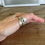 Spoon cuff ring ETERNALLY YOURS worn on hand showing bold sculptural profile - handcrafted from upcycled vintage silverware - Laughing Frog Studio