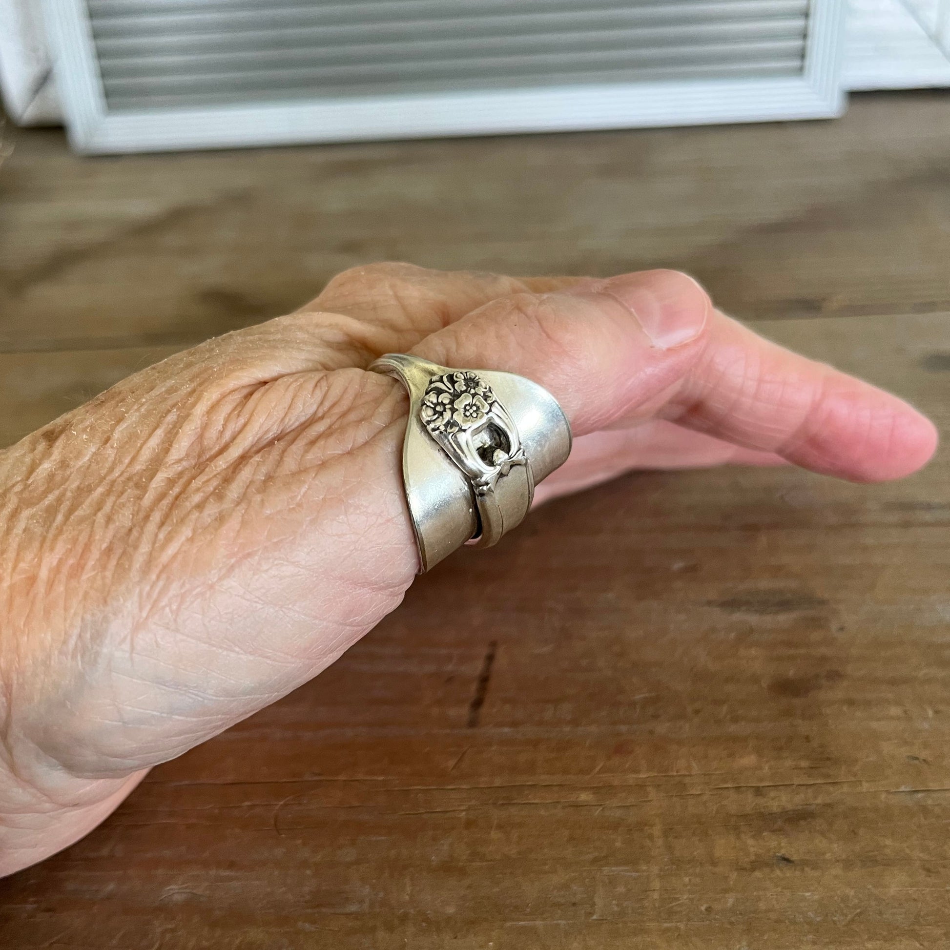 Spoon cuff ring ETERNALLY YOURS worn on hand showing bold sculptural profile - handcrafted from upcycled vintage silverware - Laughing Frog Studio