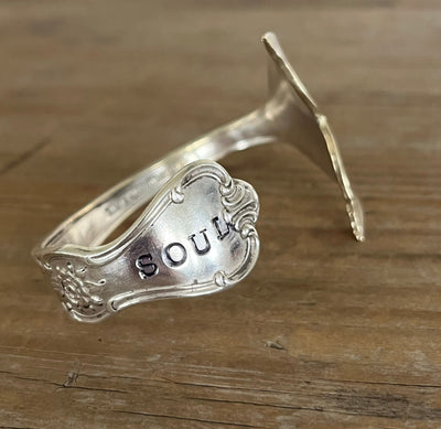 Hand-stamped "Soul" on ornate spoon bowl cuff bracelet showing Signature pattern scrollwork with mermaid tail fin - Mermaid Soul Spoon Cuff Bracelet - handcrafted from upcycled vintage silverware - Laughing Frog Studio