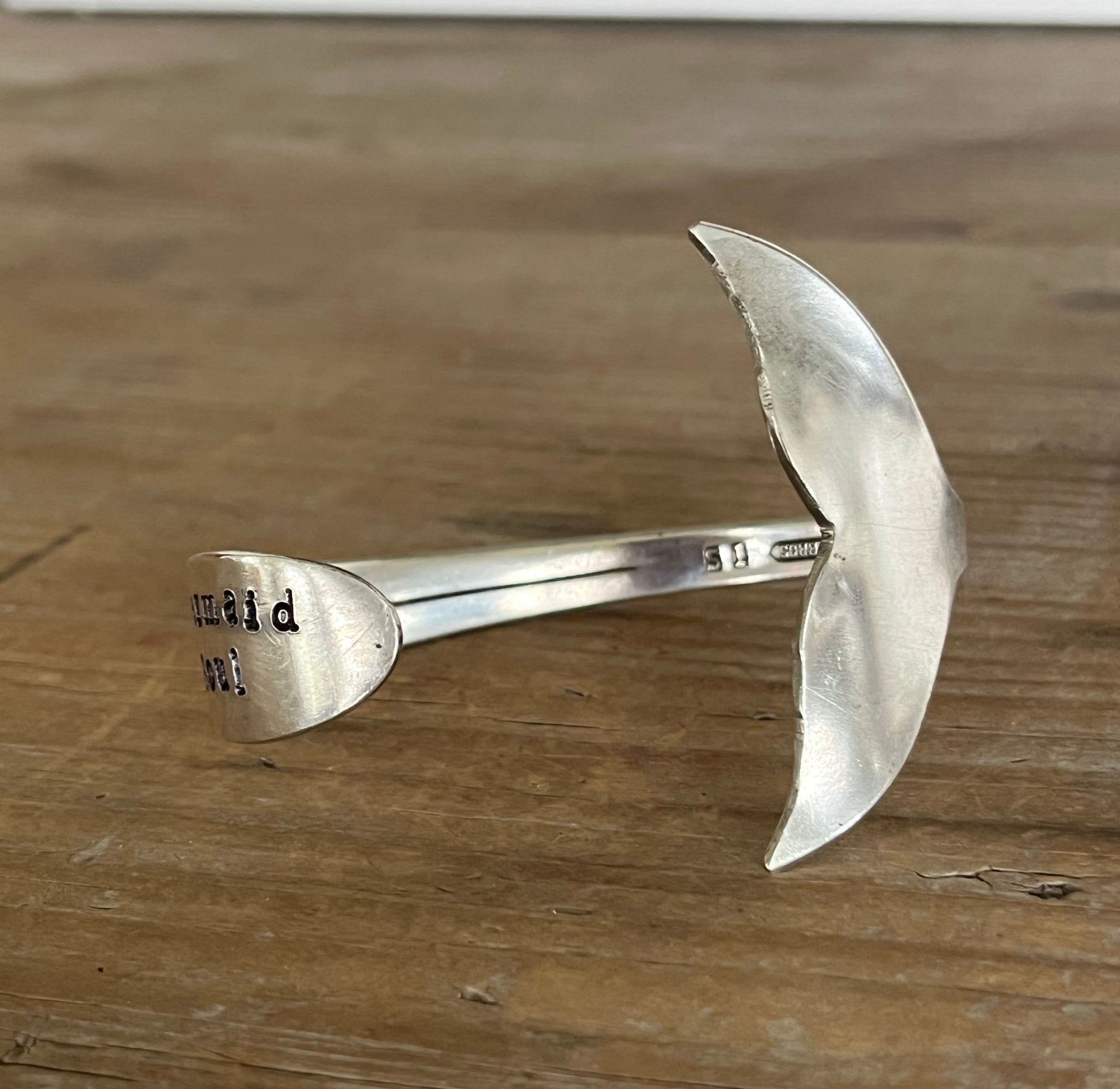 Back view of Mermaid Soul spoon cuff bracelet showing Sylva pattern engraving on cuff band and carved mermaid tail fin - handcrafted from upcycled vintage silverware - Laughing Frog Studio