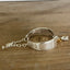 Side view of King Edward spoon link bracelet showing inner back of spoon halves and silver chain link construction - handcrafted from upcycled vintage silverware - Laughing Frog Studio