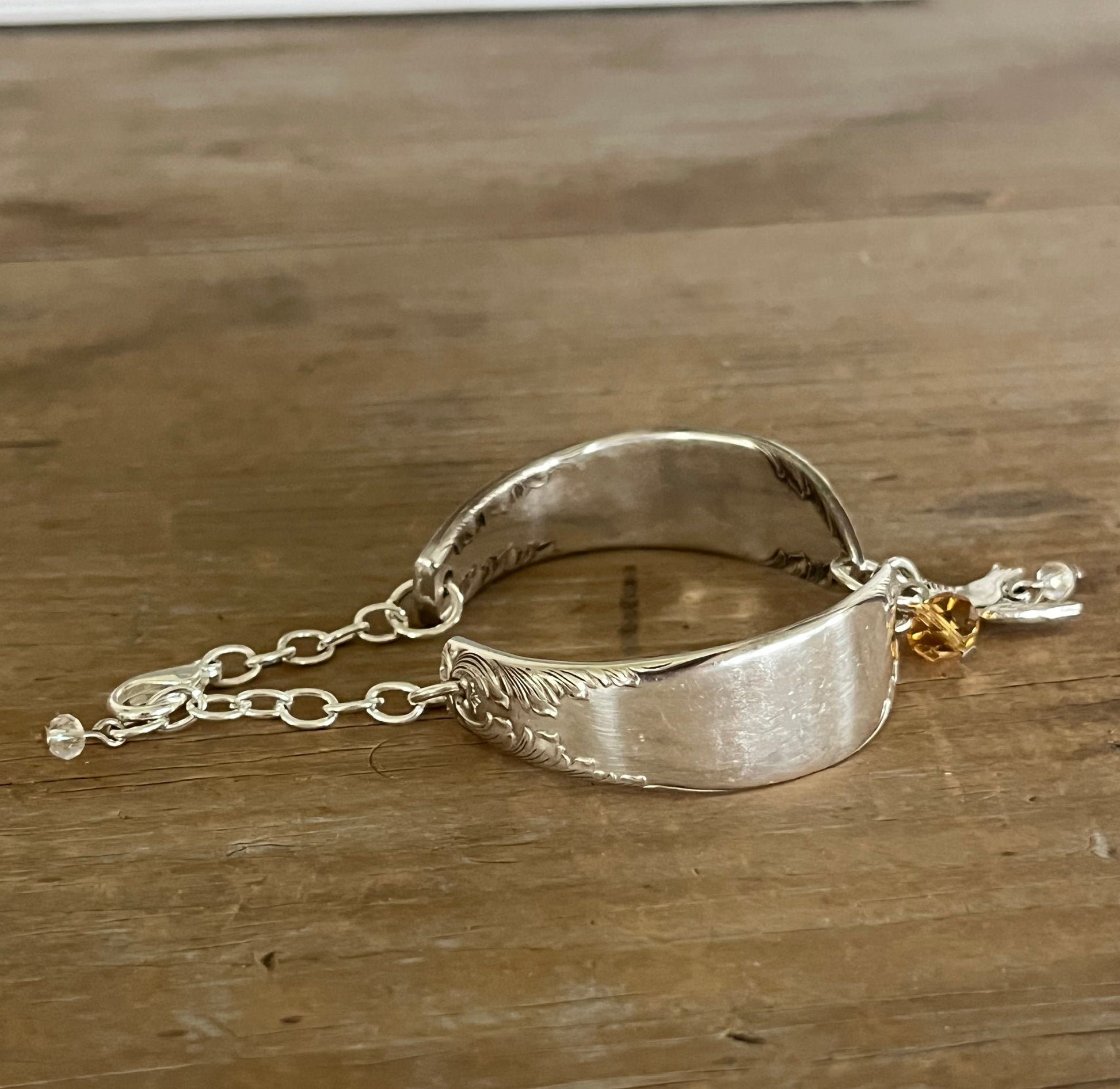 Side view of King Edward spoon link bracelet showing inner back of spoon halves and silver chain link construction - handcrafted from upcycled vintage silverware - Laughing Frog Studio