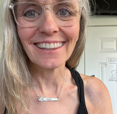 Hand-stamped VOTE bar choker necklace worn on model showing silverplate pendant with floral graphic design end on silver chain - handcrafted from upcycled vintage silverware - Laughing Frog Studio