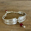 Louvain silverplate spoon link bracelet with engraved scrollwork and vintage red rosary bead detail - handcrafted from upcycled vintage silverware - Laughing Frog Studio