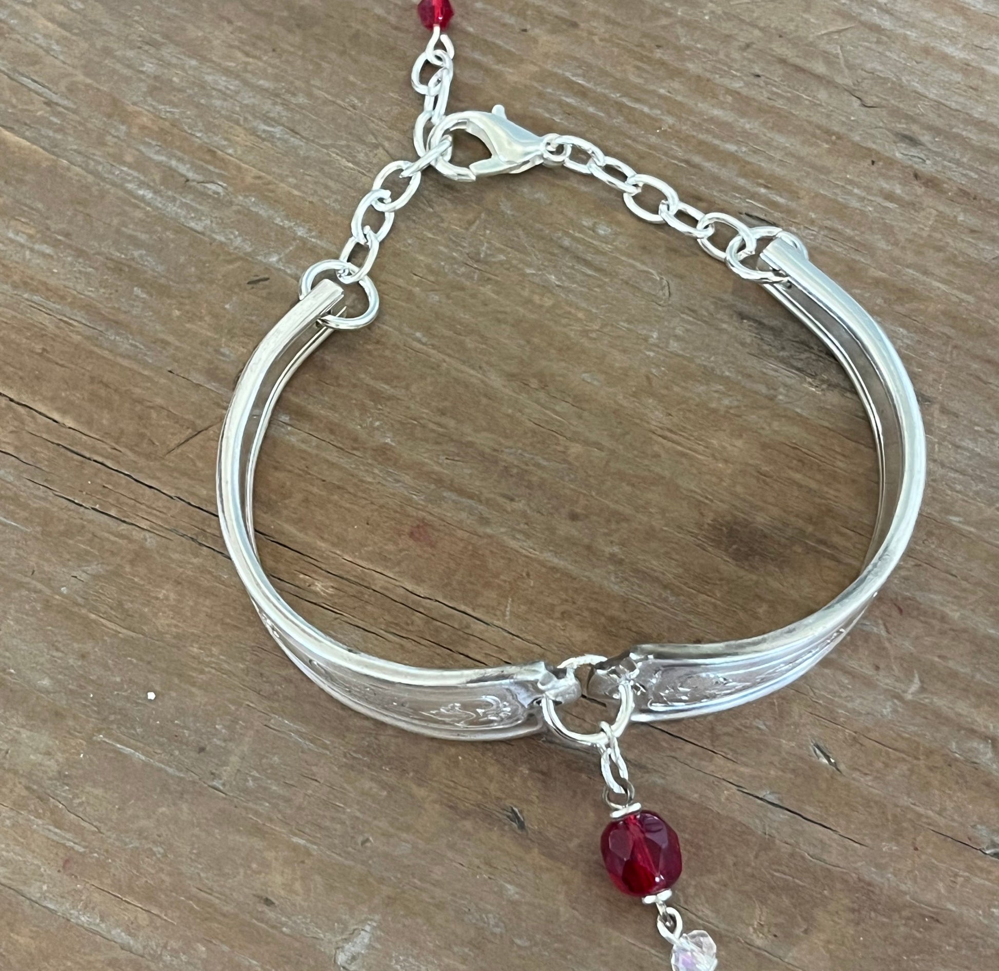 Louvain spoon link bracelet full view with adjustable silver chain clasp and red bead charm - handcrafted from upcycled vintage silverware - Laughing Frog Studio