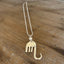 Fork elephant necklace with cultured pearl bead on wood background showing full chain length - handcrafted from upcycled vintage silverware - Laughing Frog Studio