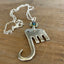 Close-up of fork elephant necklace with vintage rhinestone charm showing colorful stone detail - handcrafted from upcycled vintage silverware - Laughing Frog Studio