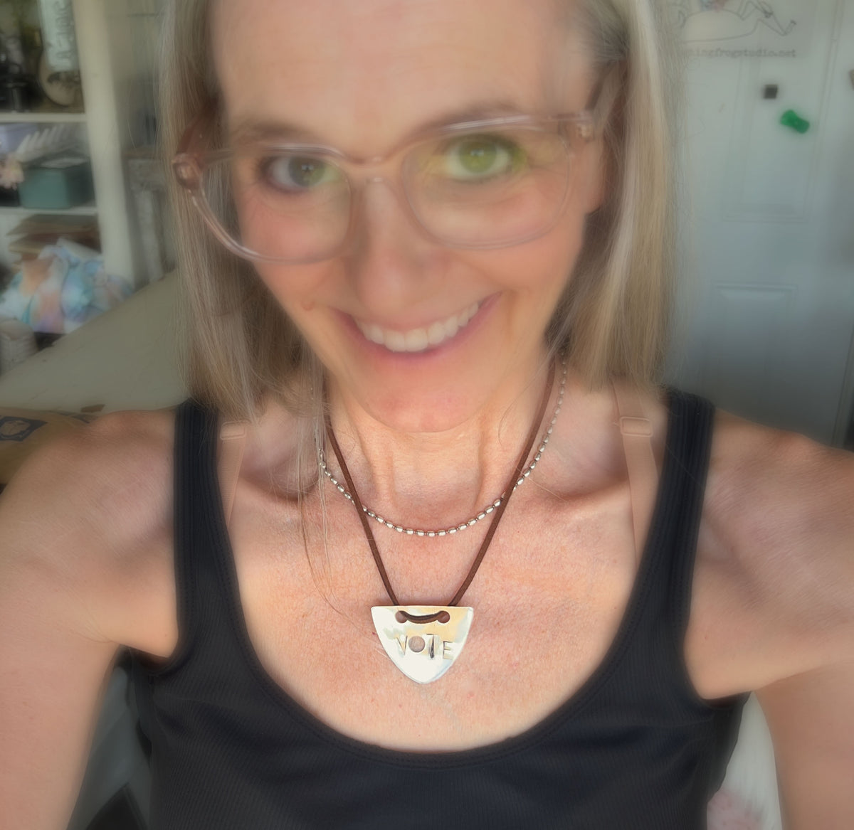 VOTE spoon necklace worn as a choker - hand-stamped silverplate pendant on faux suede cord - handcrafted from upcycled vintage silverware - Laughing Frog Studio