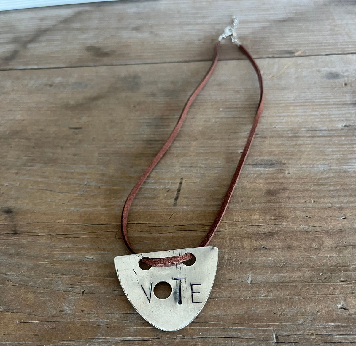 Full length view of hand-stamped VOTE spoon necklace with faux suede cord - silverplate spoon necklace - handcrafted from upcycled vintage silverware - Laughing Frog Studio


