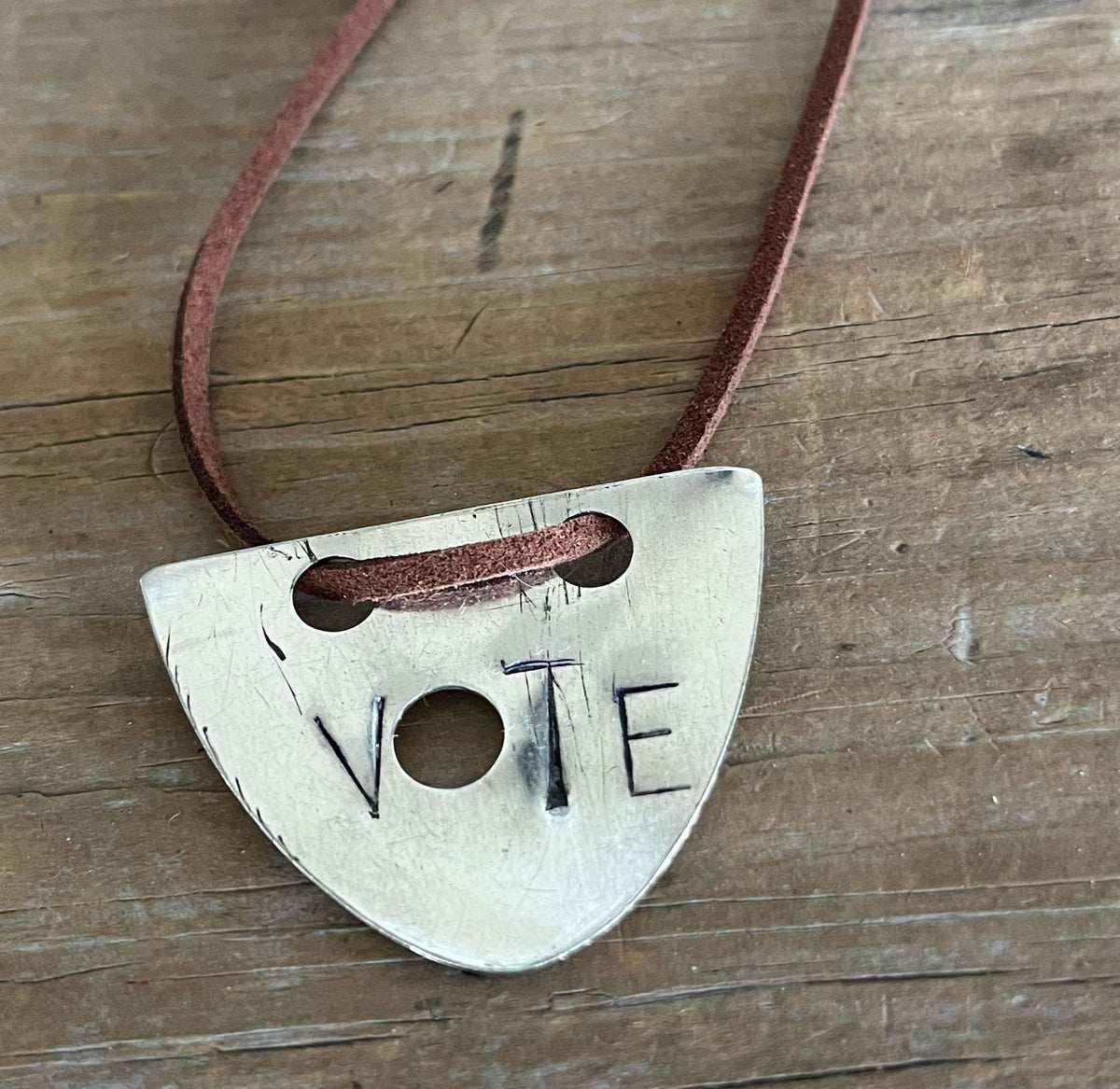 Close-up of hand-stamped VOTE spoon necklace pendant - silverplate spoon necklace - handcrafted from upcycled vintage silverware - Laughing Frog Studio