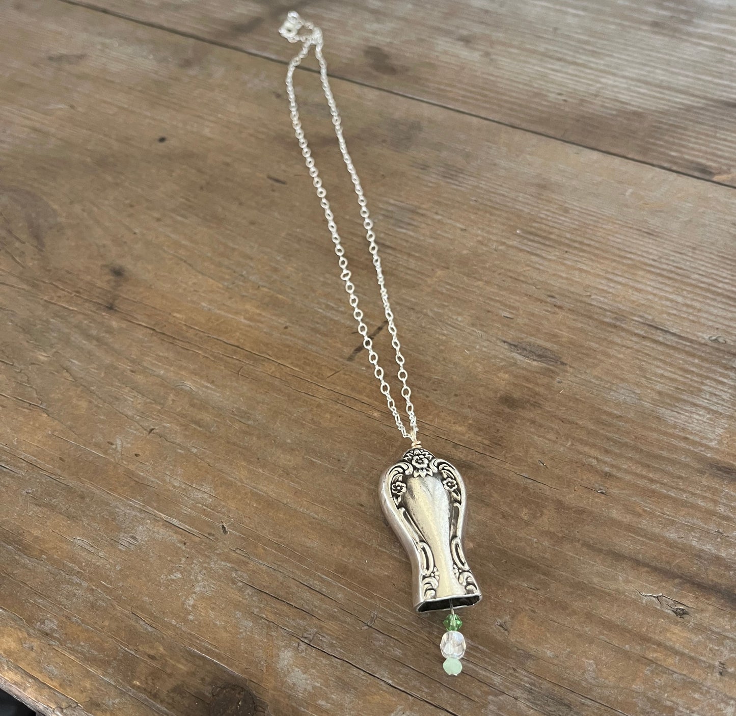 Knife bell necklace with green bead clapper - handcrafted from upcycled vintage silverware - Laughing Frog Studio