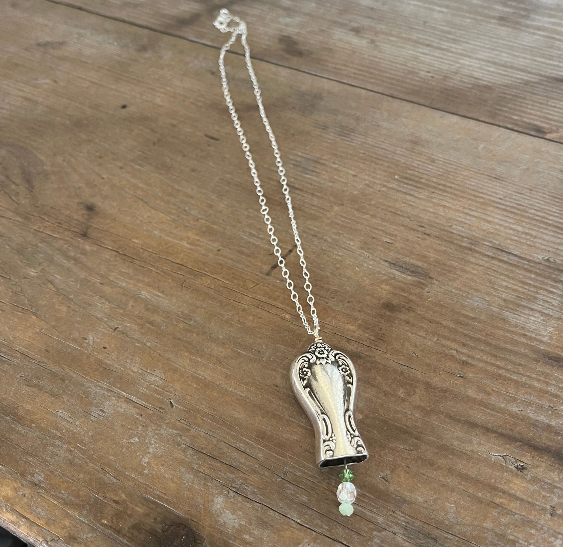 Knife bell necklace with green bead clapper - handcrafted from upcycled vintage silverware - Laughing Frog Studio