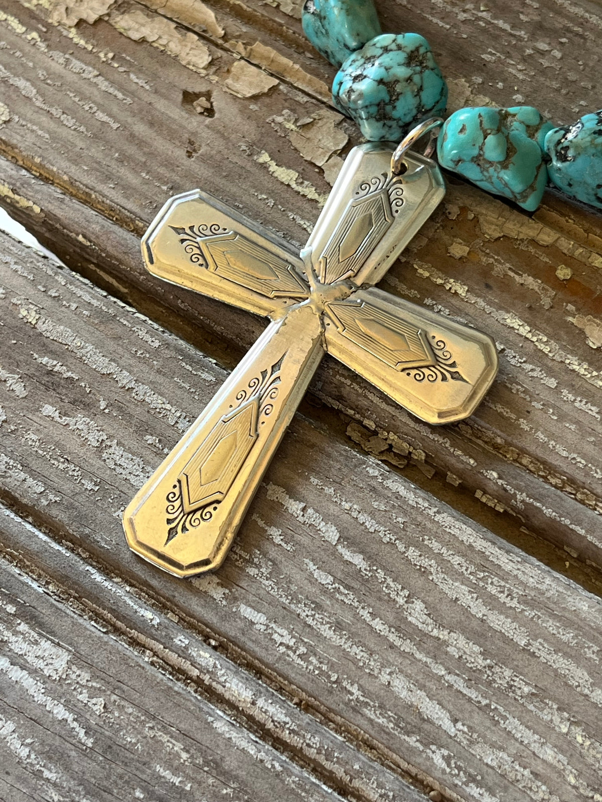 Close-up of NUART cross with geometric and scroll details - Spoon cross necklace - handcrafted from upcycled vintage silverware - Laughing Frog Studio