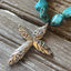 Close-up of Evening Star floral spoon-handle cross pendant with turquoise howlite beads on rustic wood - Spoon cross choker necklace - handcrafted from upcycled vintage silverware - Laughing Frog Studio